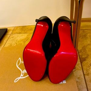Red Bottom Booties all leather black with zipper on the inner side.
